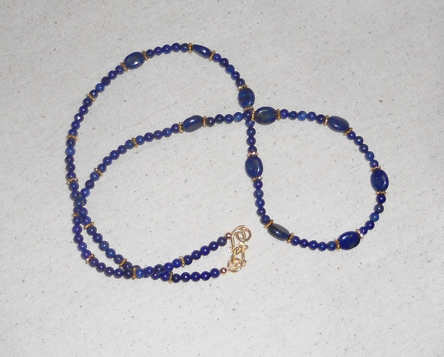 Blue lapis lazuli necklace semiprecious stone jewelry packaged in a colorful gift bag 131