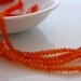 Pretty orange carnelian faceted rondelles 3-3.5mm 1/4 strand