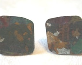 Recycled newspaper square stud earrings with silver fixings.