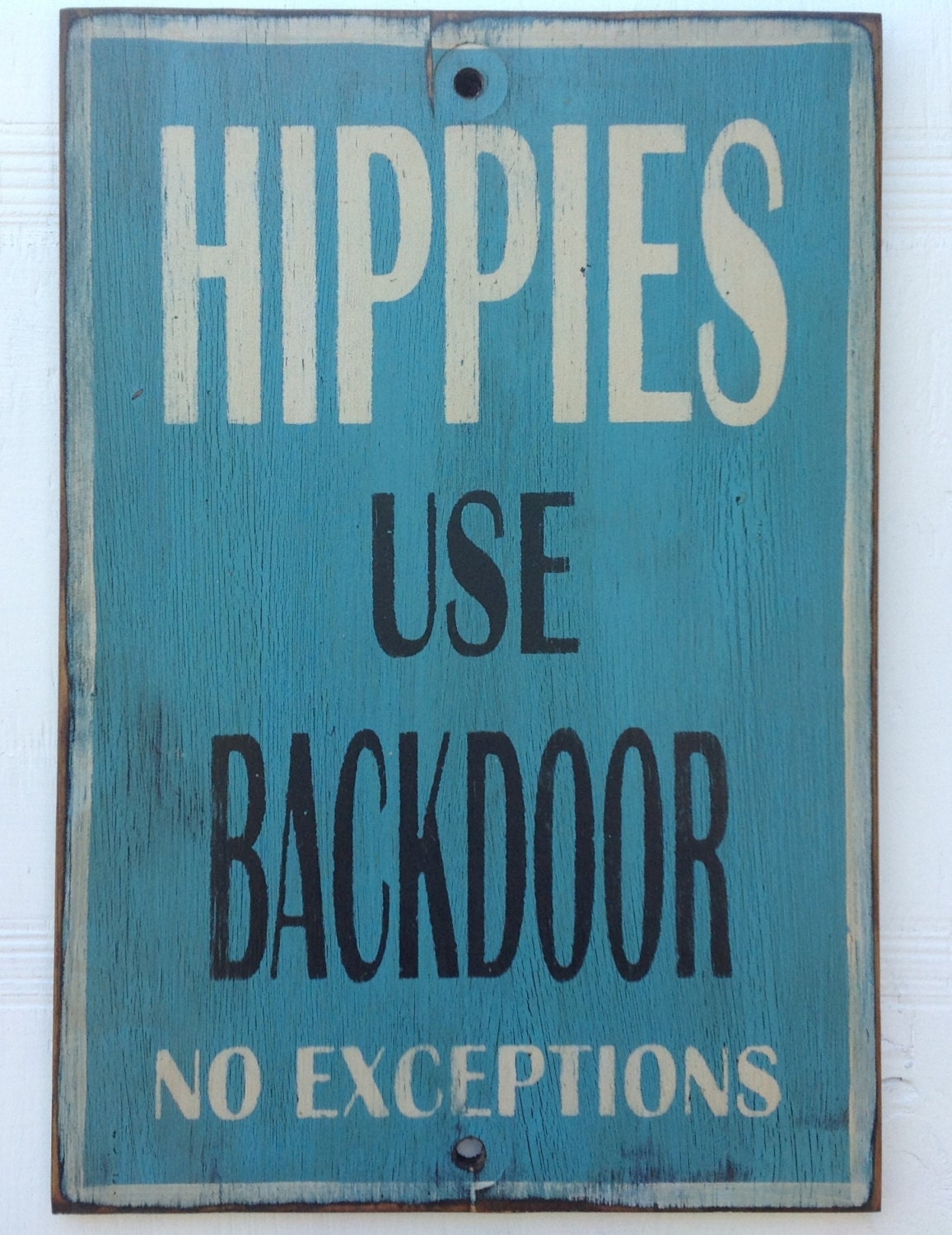Hippies use back door sign made from reclaimed plywood