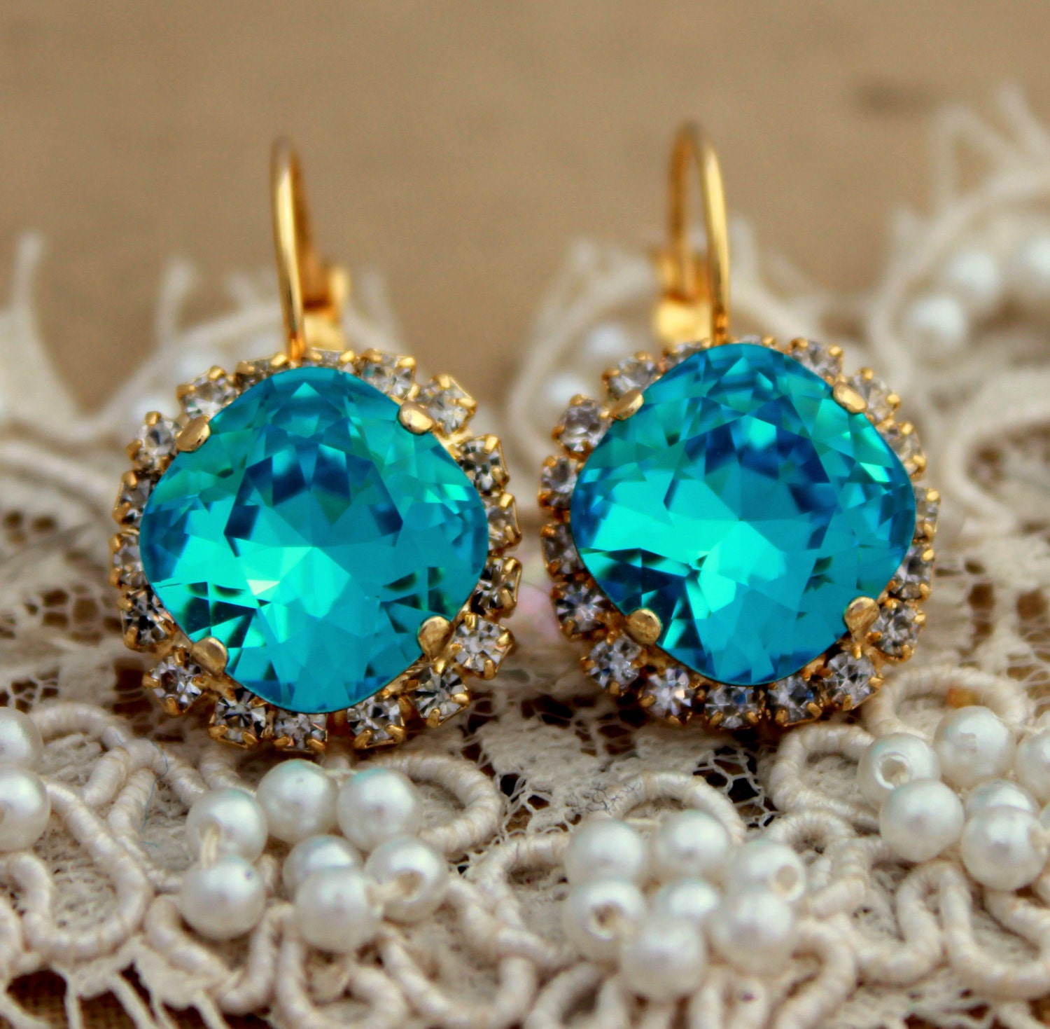 Crystal aqua blue color earring - 14 k plated gold post earrings real Swarovski rhinestones .