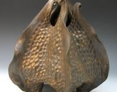 Carved porcelain urchin vessel in bronze glaze