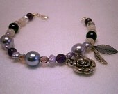Handmade Purple Goddess Glass Beaded Bracelet with Etheric Mother Earth Leaf, Amethyst gemstones and Silver coloured Angel Feather