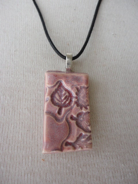 Pottery necklace of impressed leaves in dusty rose