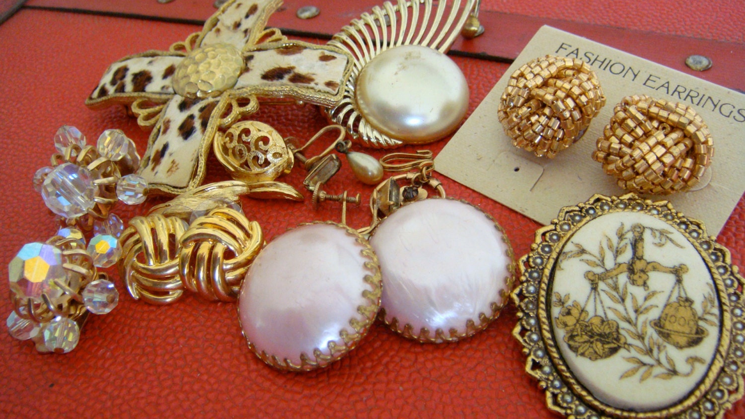 Lot of 60s 70s gold and pink hued pins, brooch, clip on earrings and ear cuff