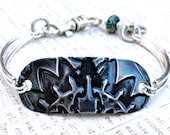 Embossed Sunflower Bracelet Sleek Silver and Black w/ bead and Ohm charm
