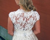 Silk wedding dress and  lace Wrap with cap sleeves. sweetheart  with low lace up back and princess ballgown skirt with small train. Pockets
