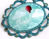 float - a hand painted brooch