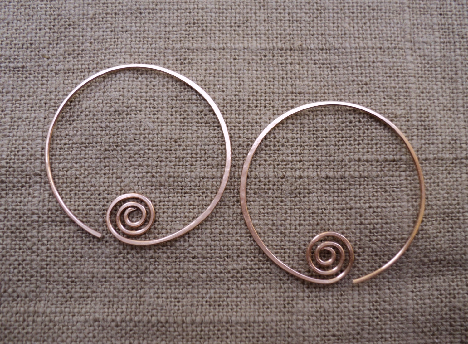 Copper hand hammered hoop earrings. Medium sized copper abstract minimal one-piece women's hoop earrings.