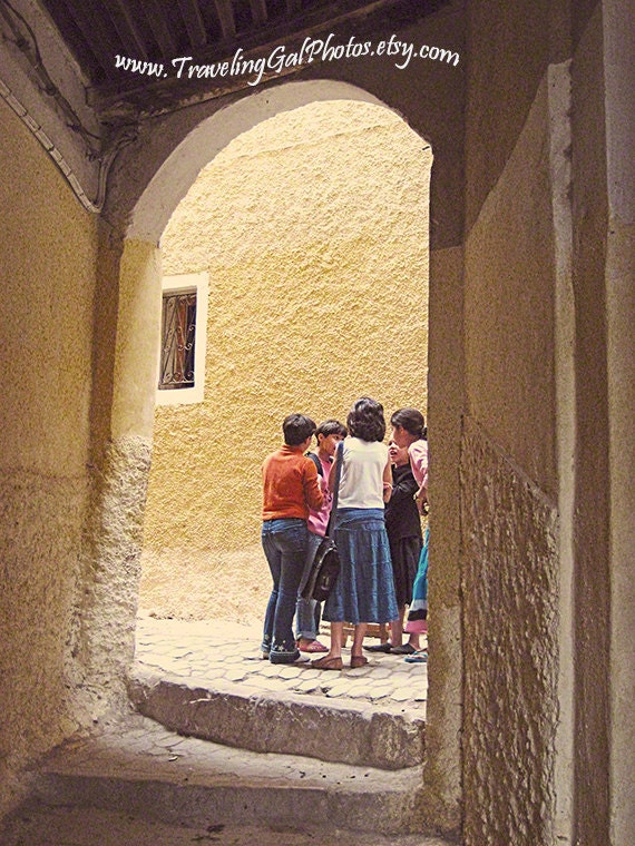 Travel photography children whispering Fes medina Morocco street photography culture Islam yellow soft white shadow 10x8 fine art photo