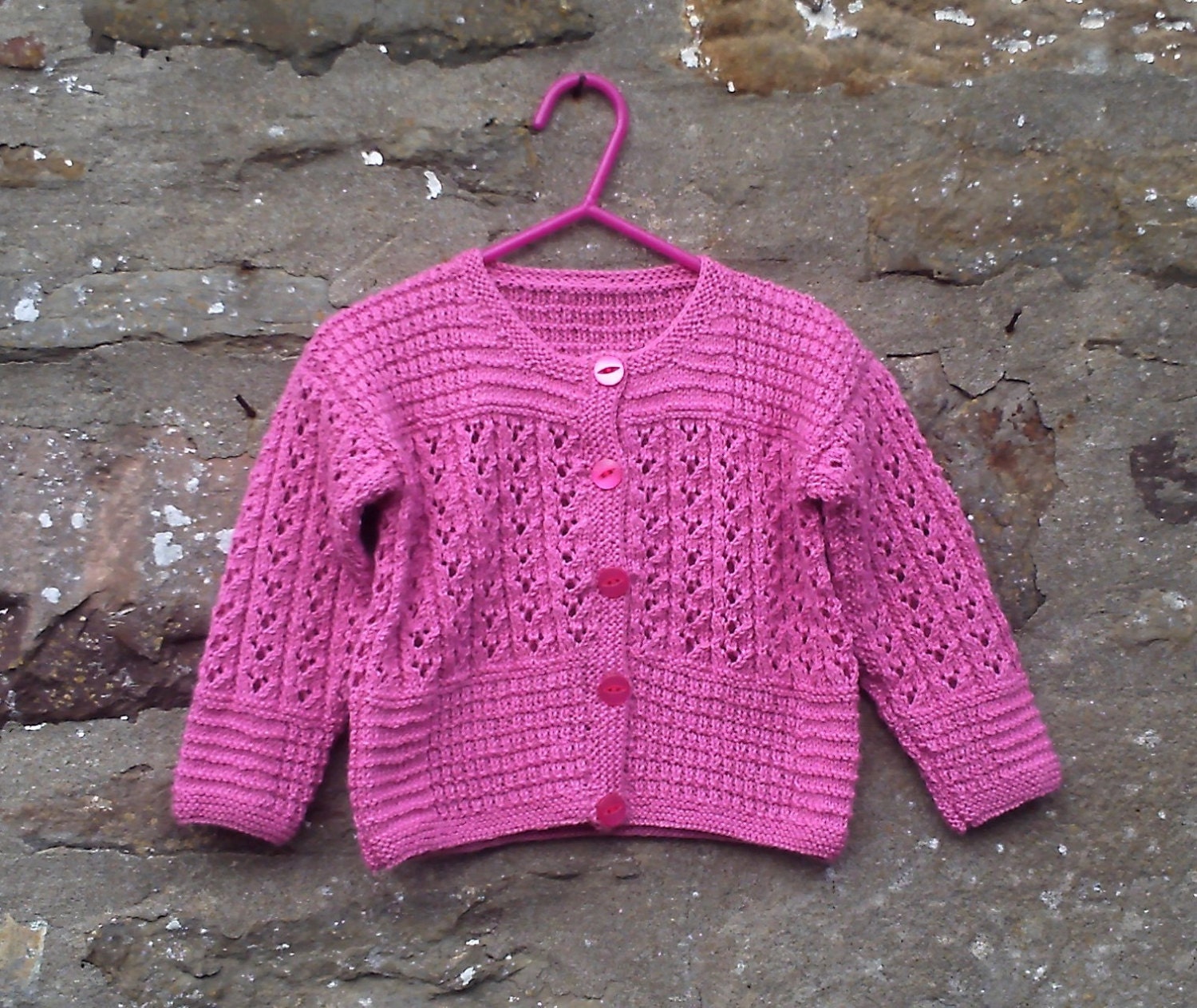 Hand knitted little girl's pink lacy cardigan. 22" chest