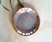 terracotta speckled plate with turquoise and gold