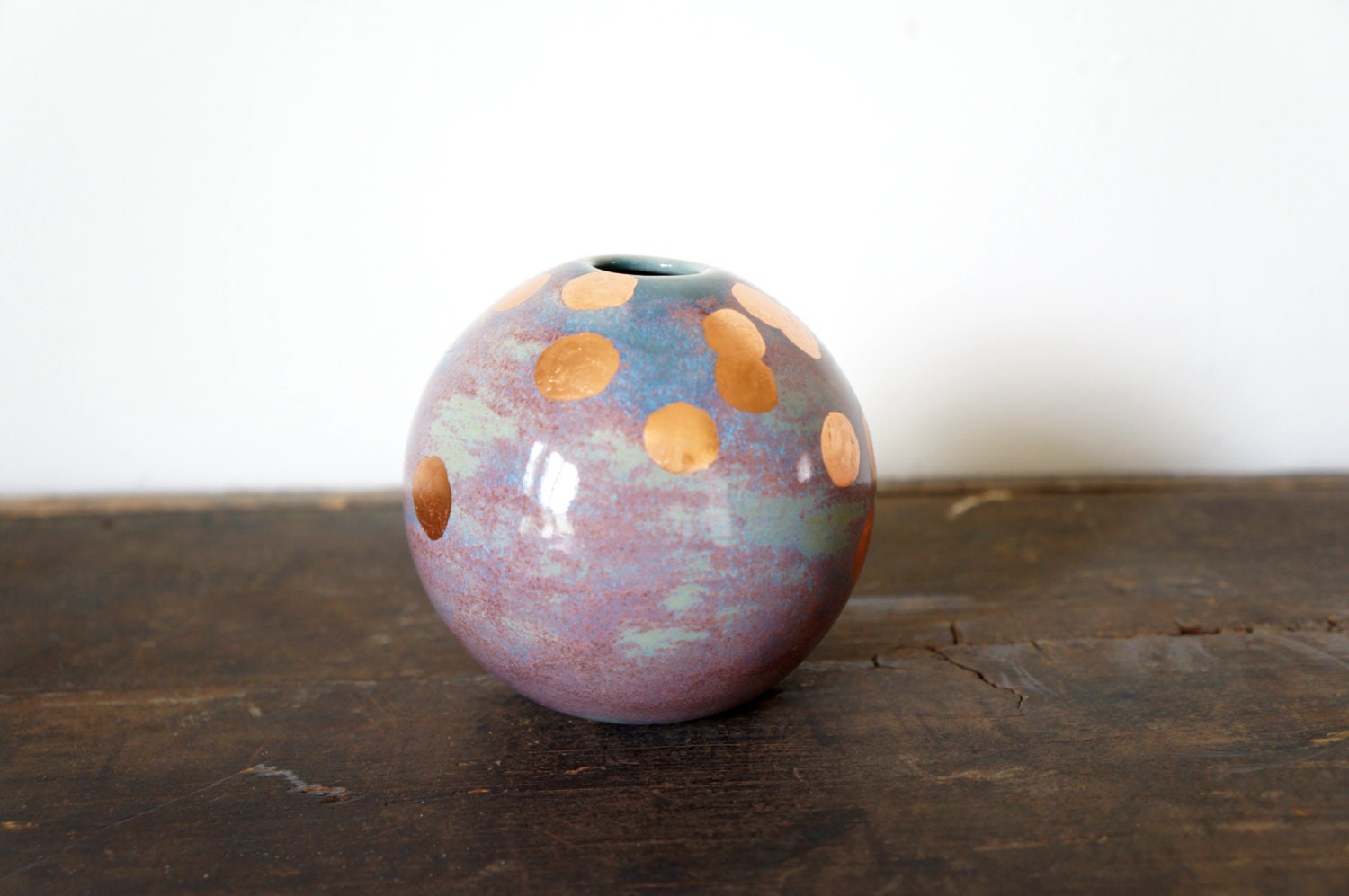 multi colored ball vase with copper spotted design