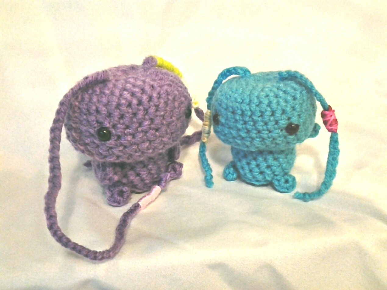Two kawaii little monsters in purple and blue. Stuffed animal toys