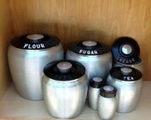 Mid century Kromex aluminum kitchen canister set, with salt and pepper shakers