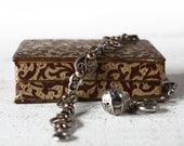 Beautiful Antique French Victorian Silver Charm Bracelet in its original carved leather case