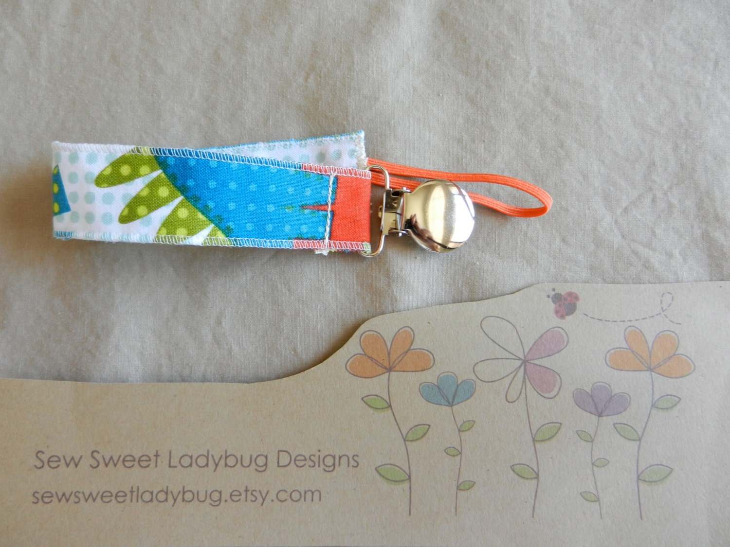 Soothie Fabric Pacifier Clip in Michael Miller Fabric Dino Roars Boy Pacifier Clip Ready to ship
