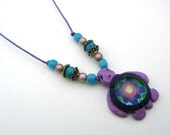 Sea turtle pendant necklace, handmade from polymer clay and glass, millefiori flower pattern, surfer girl, on thin adjustable cord