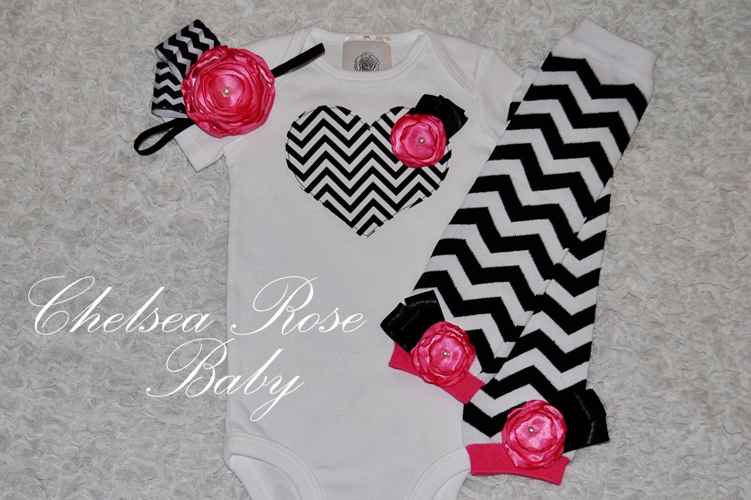 Baby Girl Chevron Heart Onesie with a hot pink rose, Matching chevron headband, and Black and white Chevron Leg Warmers set