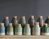 one SAMPLE - off white clay and sand colored stoneware with blue and green glaze tests. branded vitrifiedstudio samples