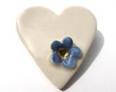 Cream heart brooch, porcelain, with small blue and gold flower