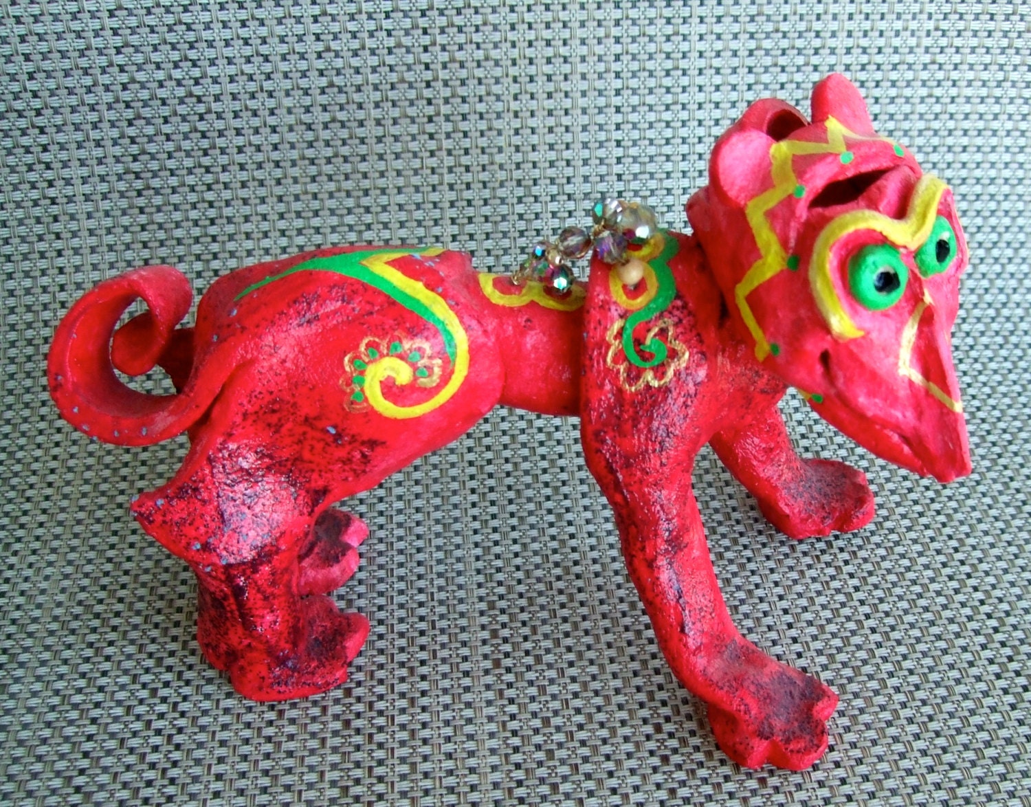 fired clay imaginative creature with acrylic paint and glass beads   6" tall & 8 1/2 "long about 4 1/2 "wide