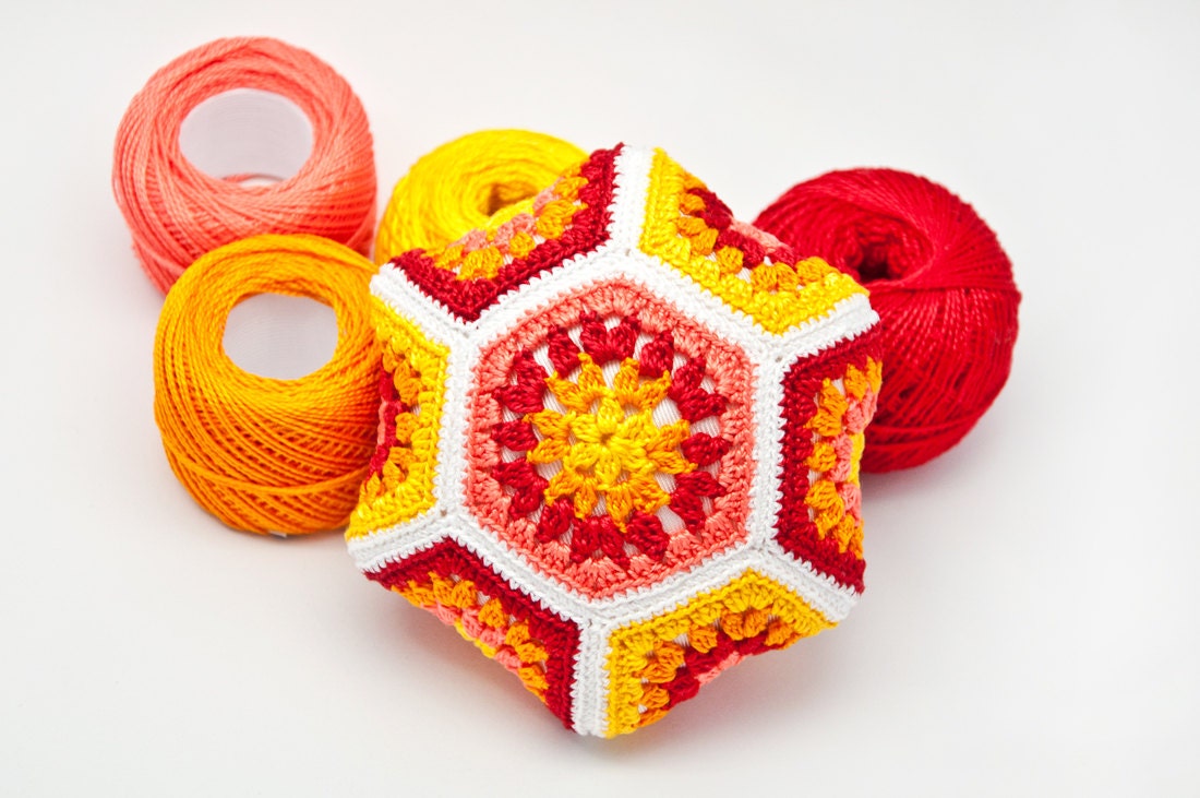 Crocheted pincushion, hexagon shape, cotton thread, bright colors, red, yellow, orange, handmade