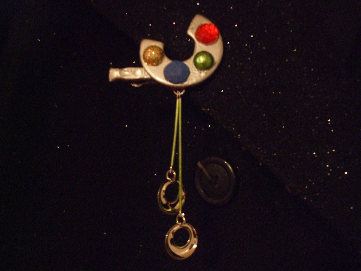 UFO brooch battle damaged starship   mother ship spacecraft extraterrestrial silver colored with lights   little ufos on tractor beams
