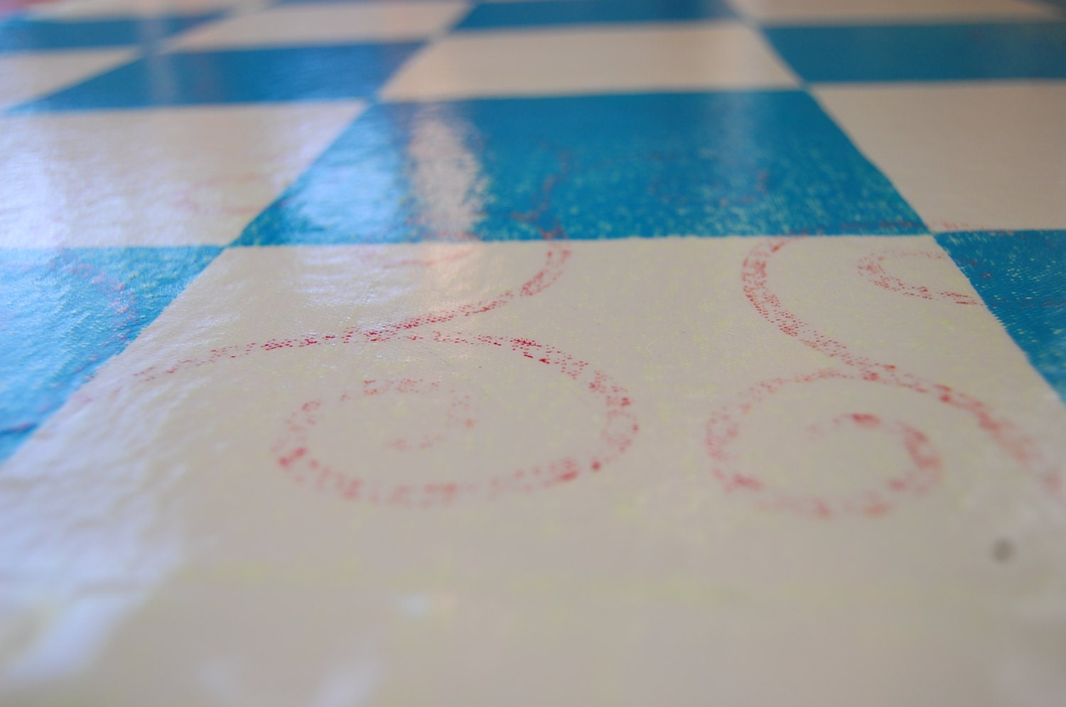 blue & white checkered floorcloth, lime green with red swirl sublayer