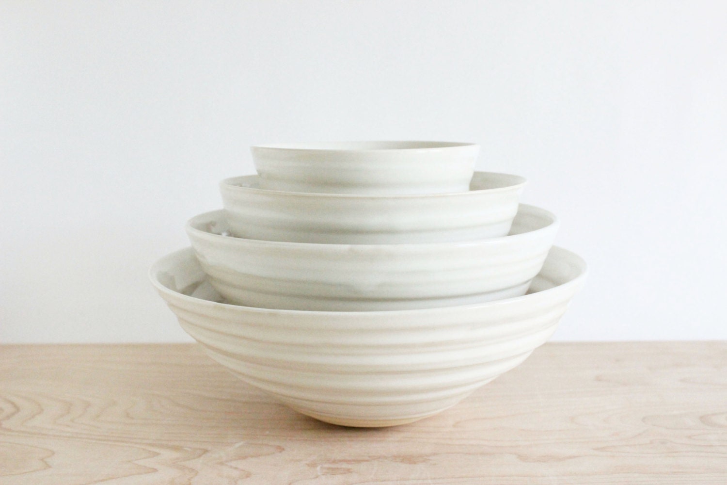 Four-piece nesting bowl set, white modern ceramic pottery bowls