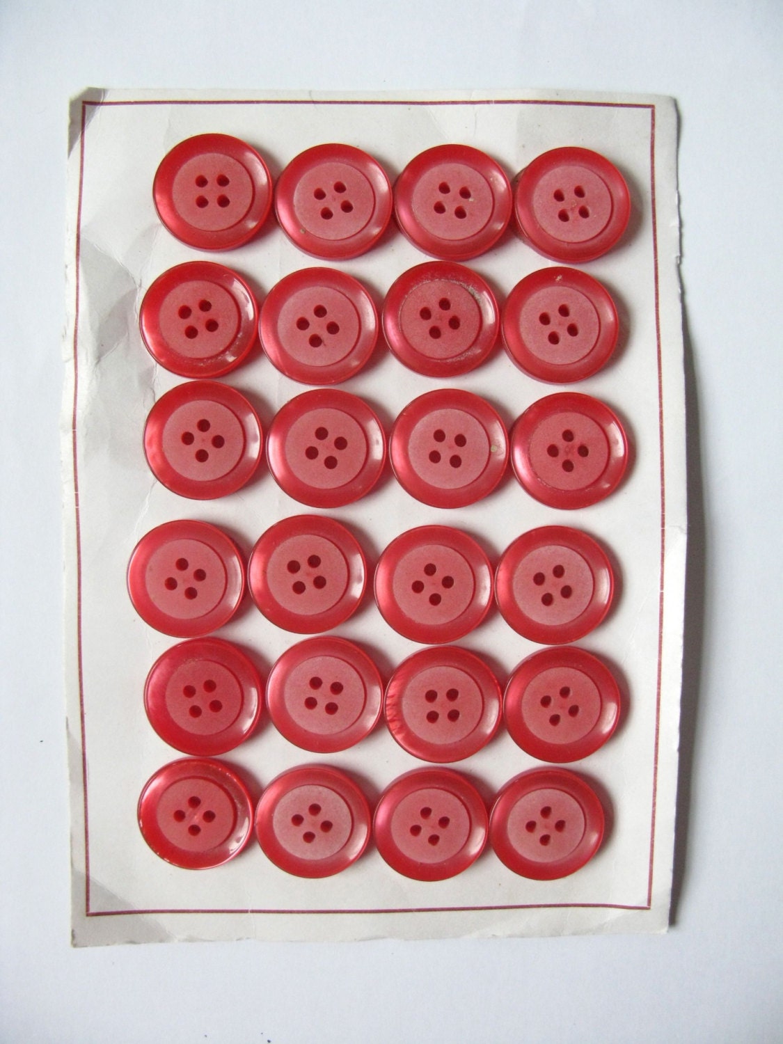 BIG red pink plastic vintage buttons on original card.