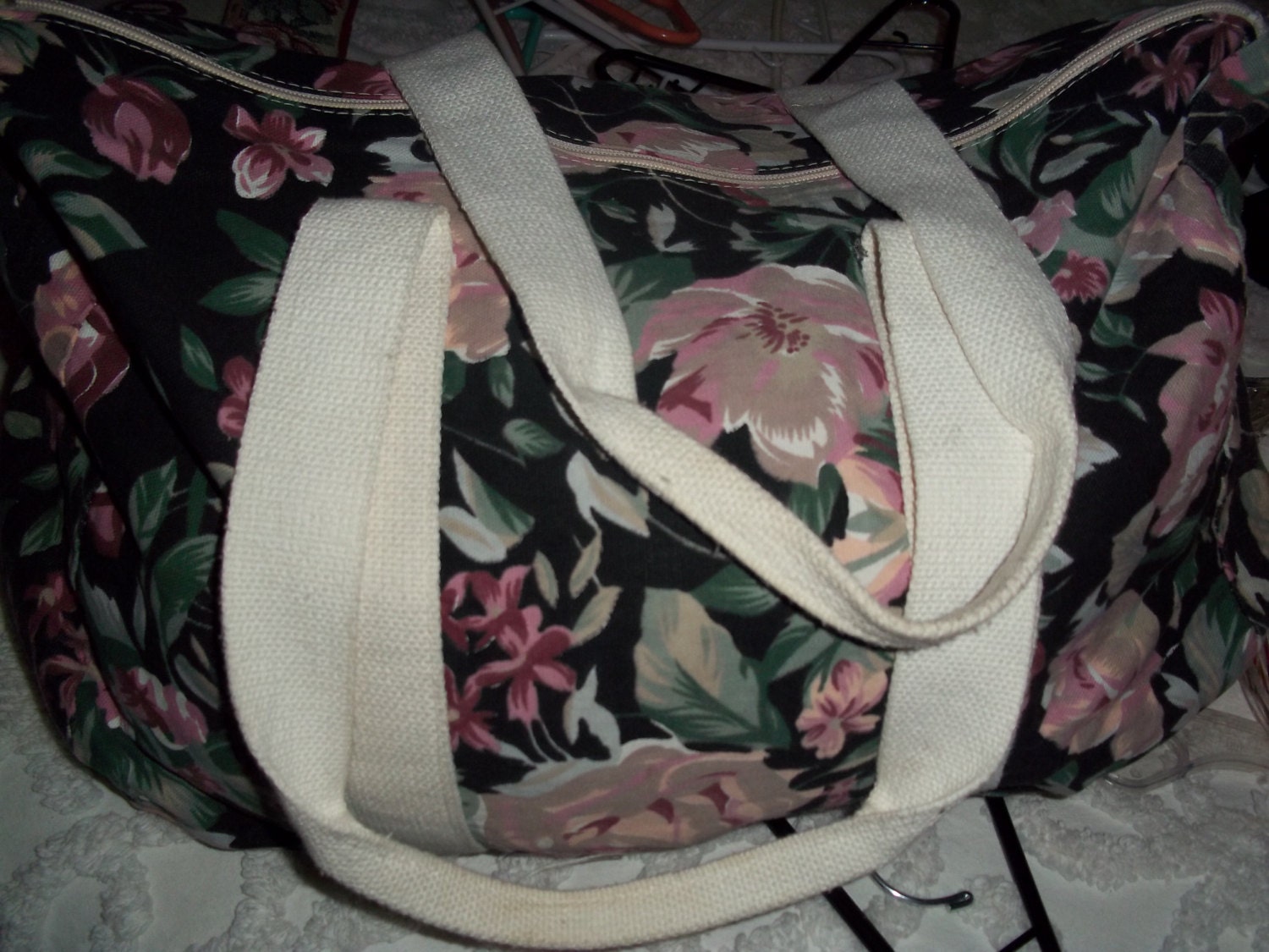 Lovely black cotton floral duffle bag with cream straps and zip top. Excellent condition.