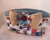 Handwoven paper basket with teal paper trimmings and flower