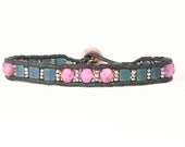 Friendship bracelet.  Teal tila beads, lavender glass beads, silver seed beads.  Black cord, lavender button.