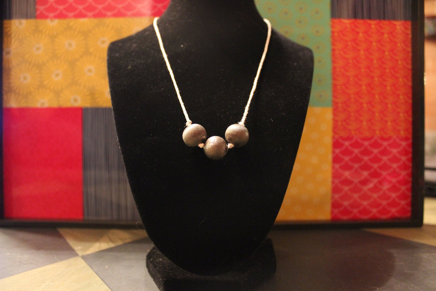 Gray beads on white string