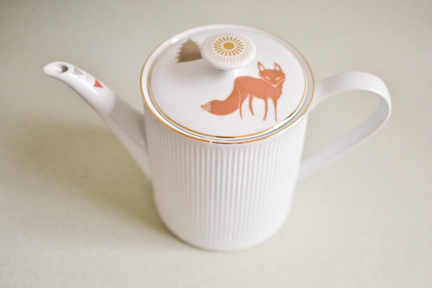 Teapot with fox and trees
