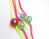 neon evil eye bracelet in yellow and pink glass evil eye charms pink green girl teenagers birthday gift present summer beach neon istanbul
