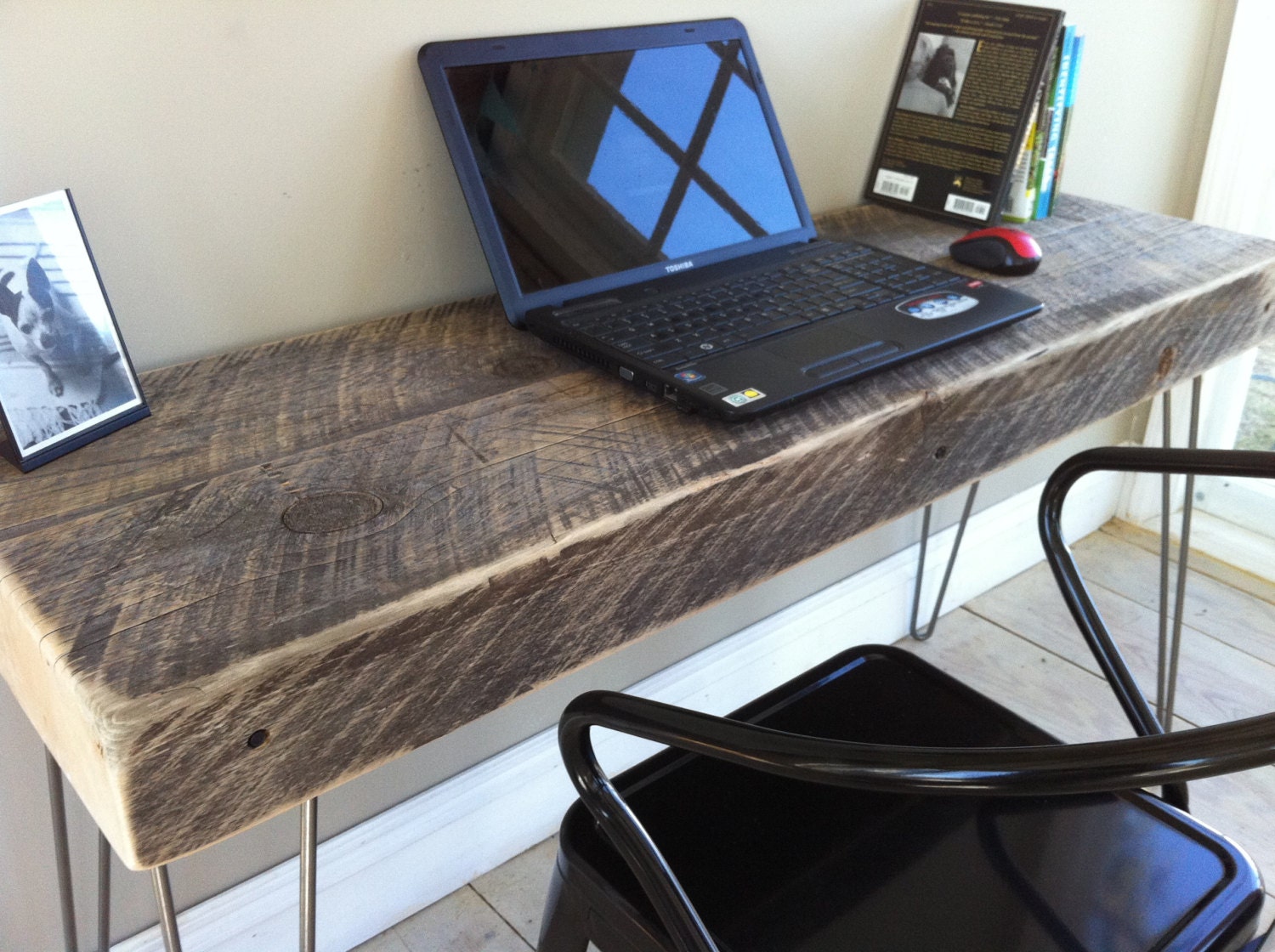 Weathered barnwood desk, modern industrial style featuring hairpin legs.