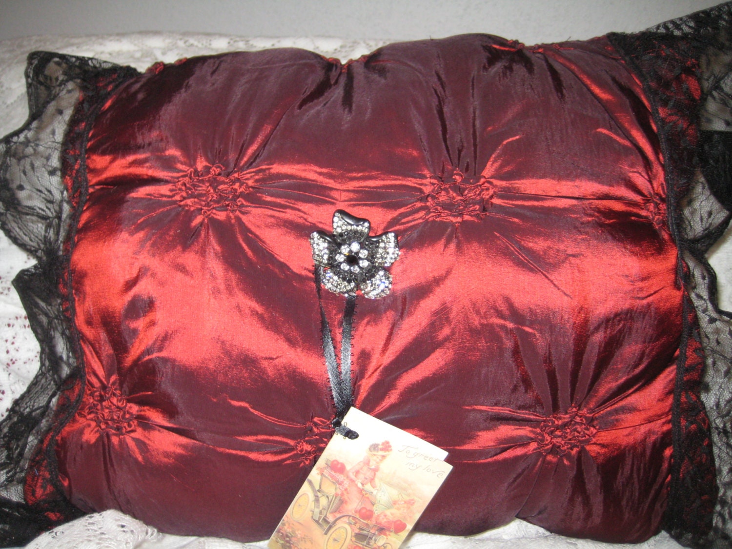Victorian red satin pillow.