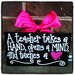 A teacher takes a HAND, opens a MINd, and touches a heart.