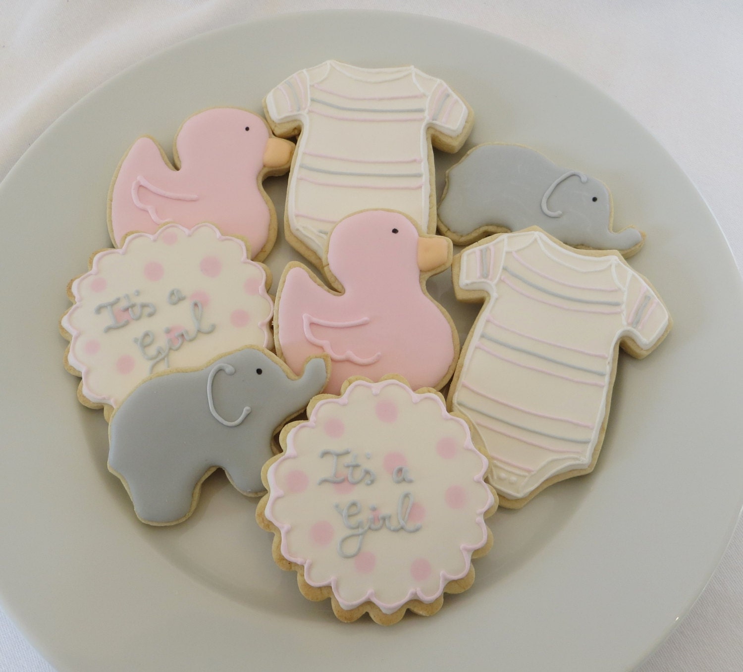 Baby shower cookie favors decorated for a girl in pink and gray: onesies, ducks, elephants and personalized rounds, 1 dozen