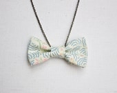 White Bow Tie Necklace with a Blue Pattern and Small Flowers