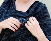 Black jersey poncho. pin strips print. removable bow pin . one size.