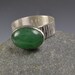Fashionable ring with aventurine cabochon