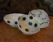 Polka dotted porcelain trio of bowls