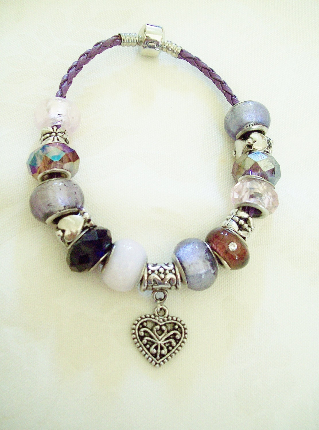 Shades of Purple, Violet and Lavender with Silver Tone Spacer Large Hole Beads and Embellished Heart Charm on Purple Braided Bracelet