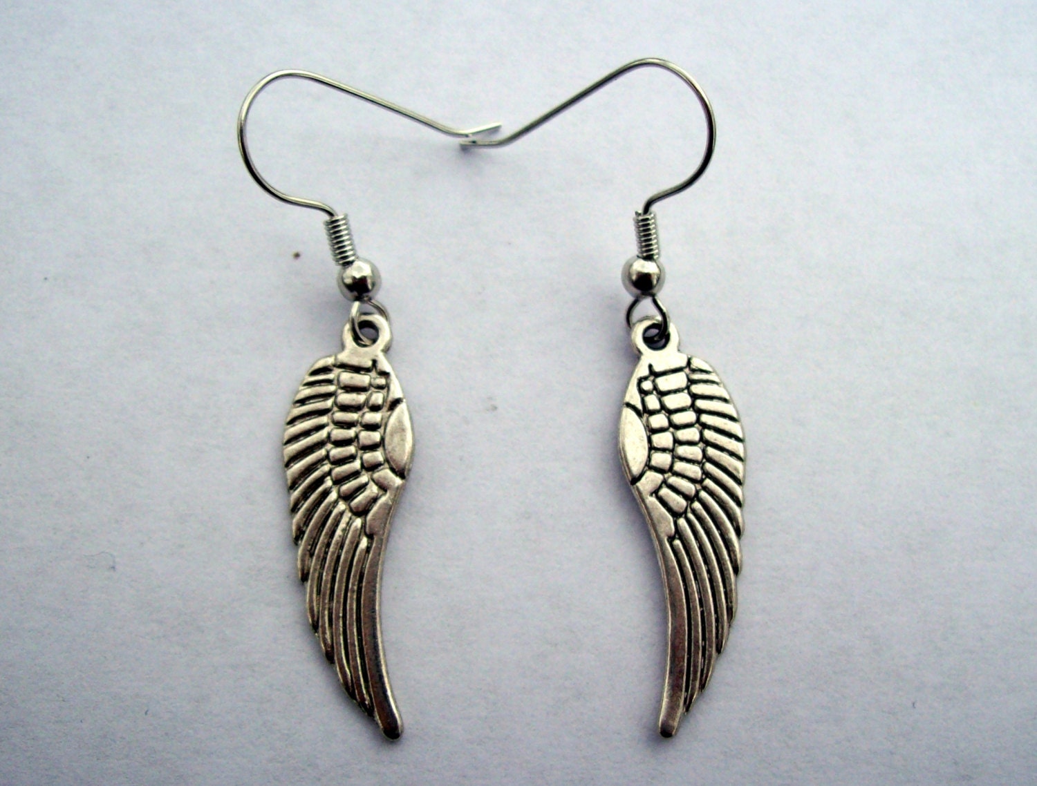 Silver angel wing earrings. Angel wings dangle earrings