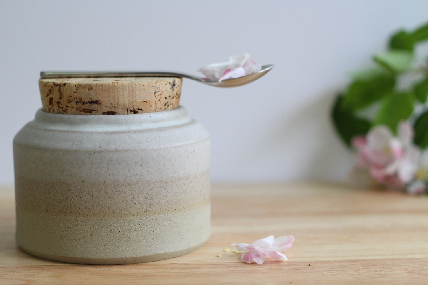 Kitchen storage jar.  Modern ceramic white, cream, brown stoneware pots with natural cork stopper.