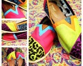 Hand painted multicolored leopard print TOMS shoes available in women's 6-11. Price of shoes included.