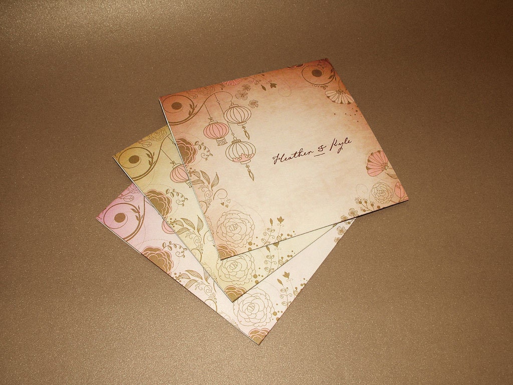 Folded wedding invitation with elegant vintage style graphics.